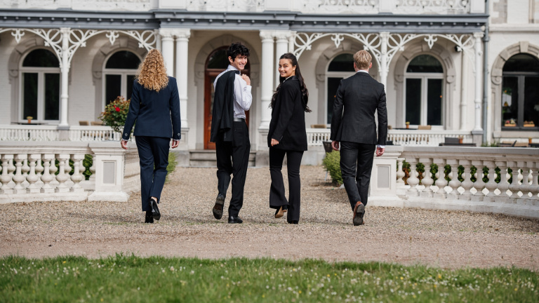 Students walking towards the castle.