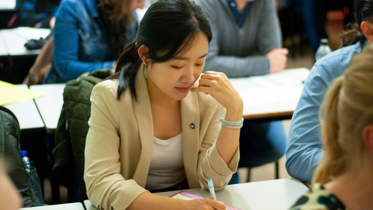International FREM Student Taking Notes at Workshop