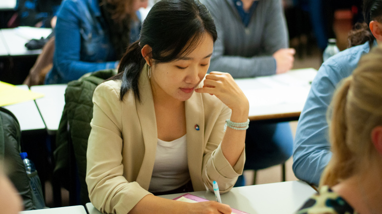 International FREM Student Taking Notes at Workshop
